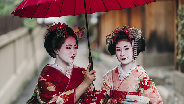 Geishas mit Schirm